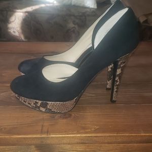 Black stilettos with snake skin accent